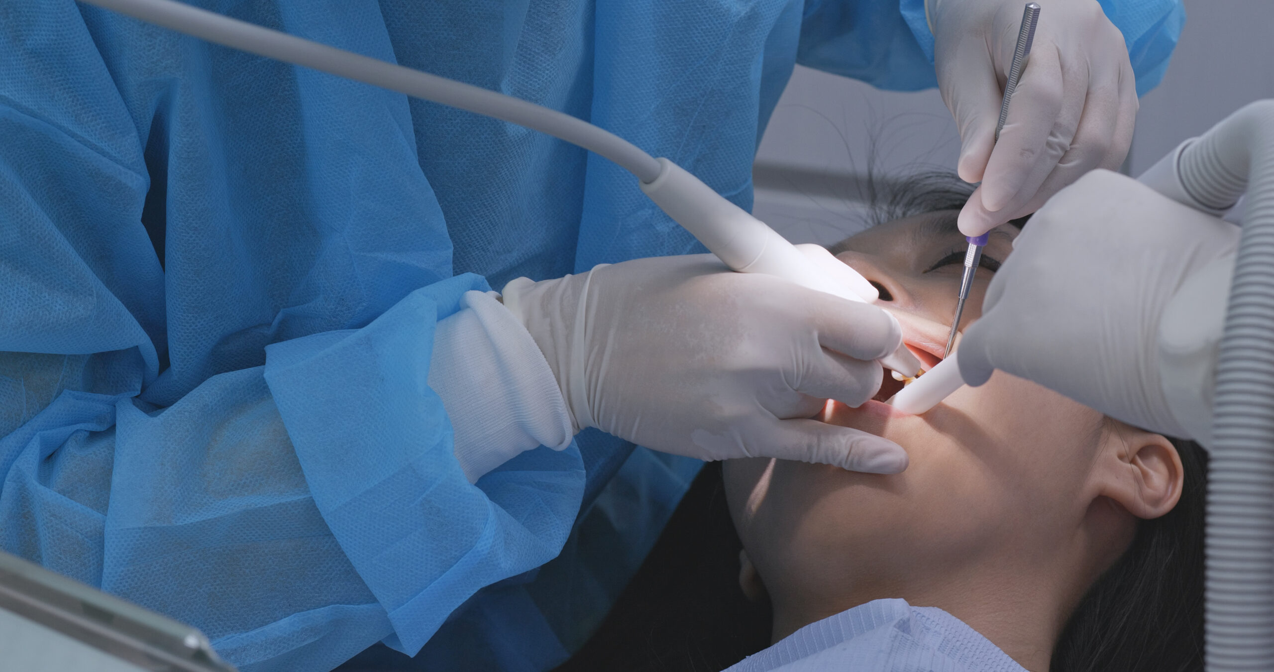Asian Woman undergo check up of tooth in dental clinic